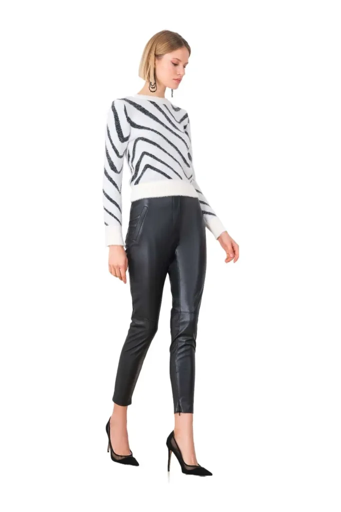 Andreola leather skinny pants, designed with a sleek, form-fitting silhouette for a bold, edgy style. Perfect for adding a touch of sophistication to both casual and evening looks, these pants offer a flattering fit and modern appeal.