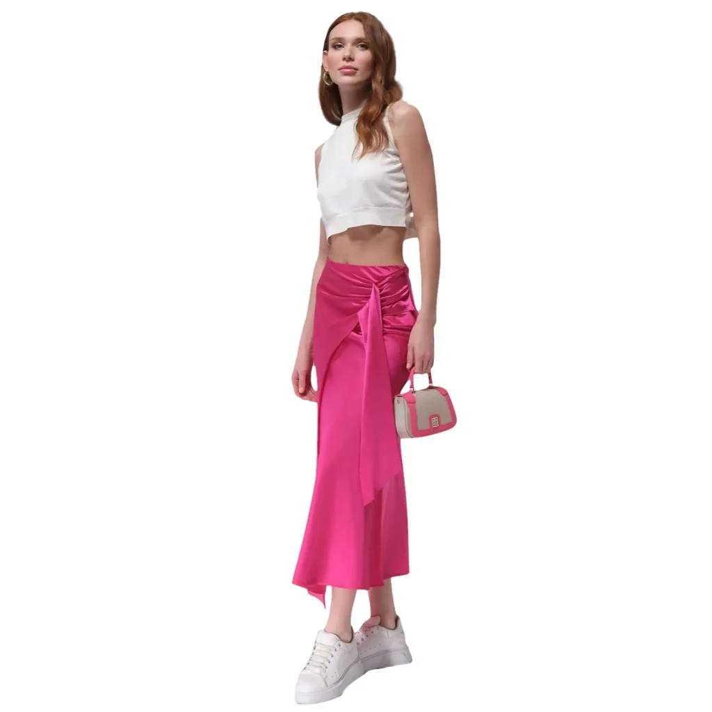 Elaiah long pink skirt with a beautifully scaled design, perfect for creating elegant and feminine outfits. The flowy, flattering silhouette makes it ideal for both casual and formal occasions, adding a touch of sophistication to any wardrobe.