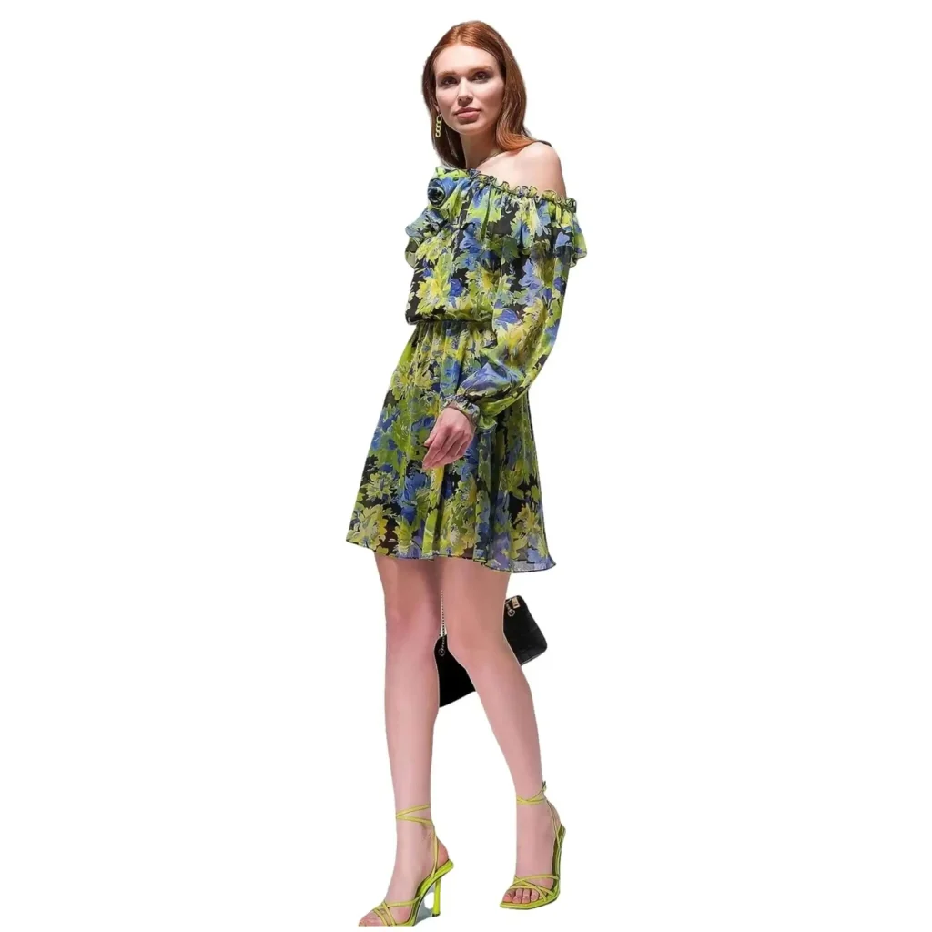 Lia off-shoulder floral print green dress with ruffled sleeves, paired with a black handbag and neon green high heels.