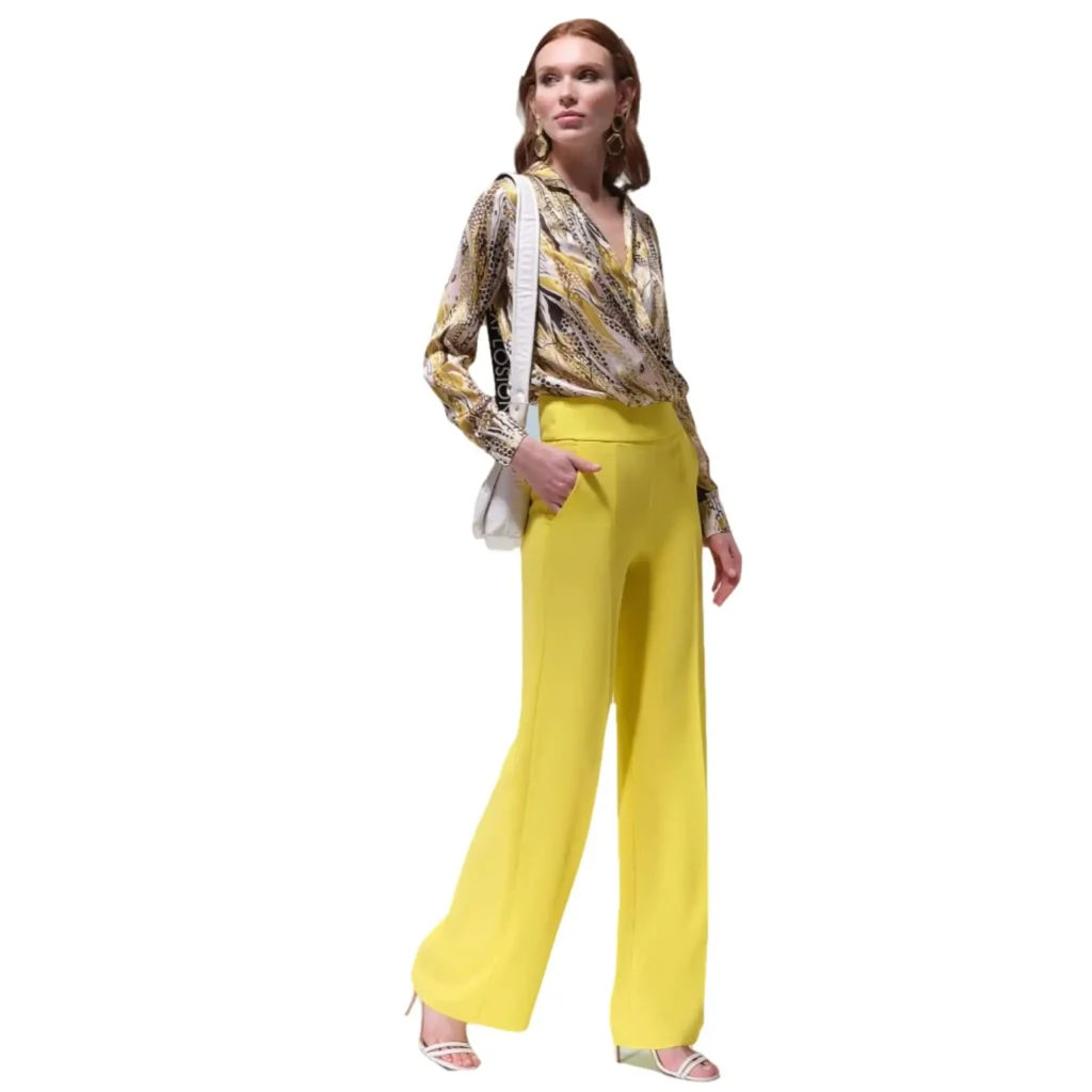 Stella bright yellow wide-leg trousers paired with a patterned blouse, perfect for a vibrant and stylish day-to-night look.