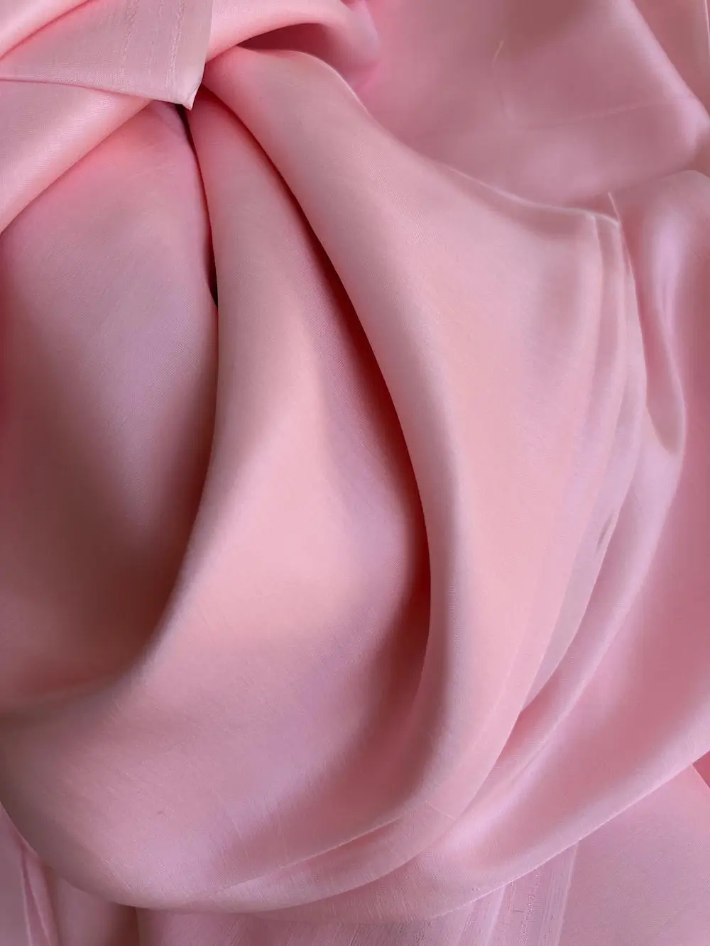 Close-up of Barbie pink Italian Mulberry Silk Satin with glossy finish and smooth texture, ideal for fashion garments