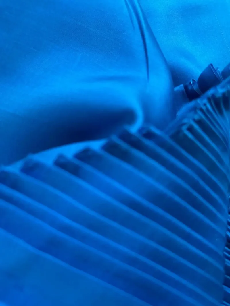 Close-up of royal blue Italian Mulberry Silk Satin with a glossy surface, ideal for elegant shirts and skirts